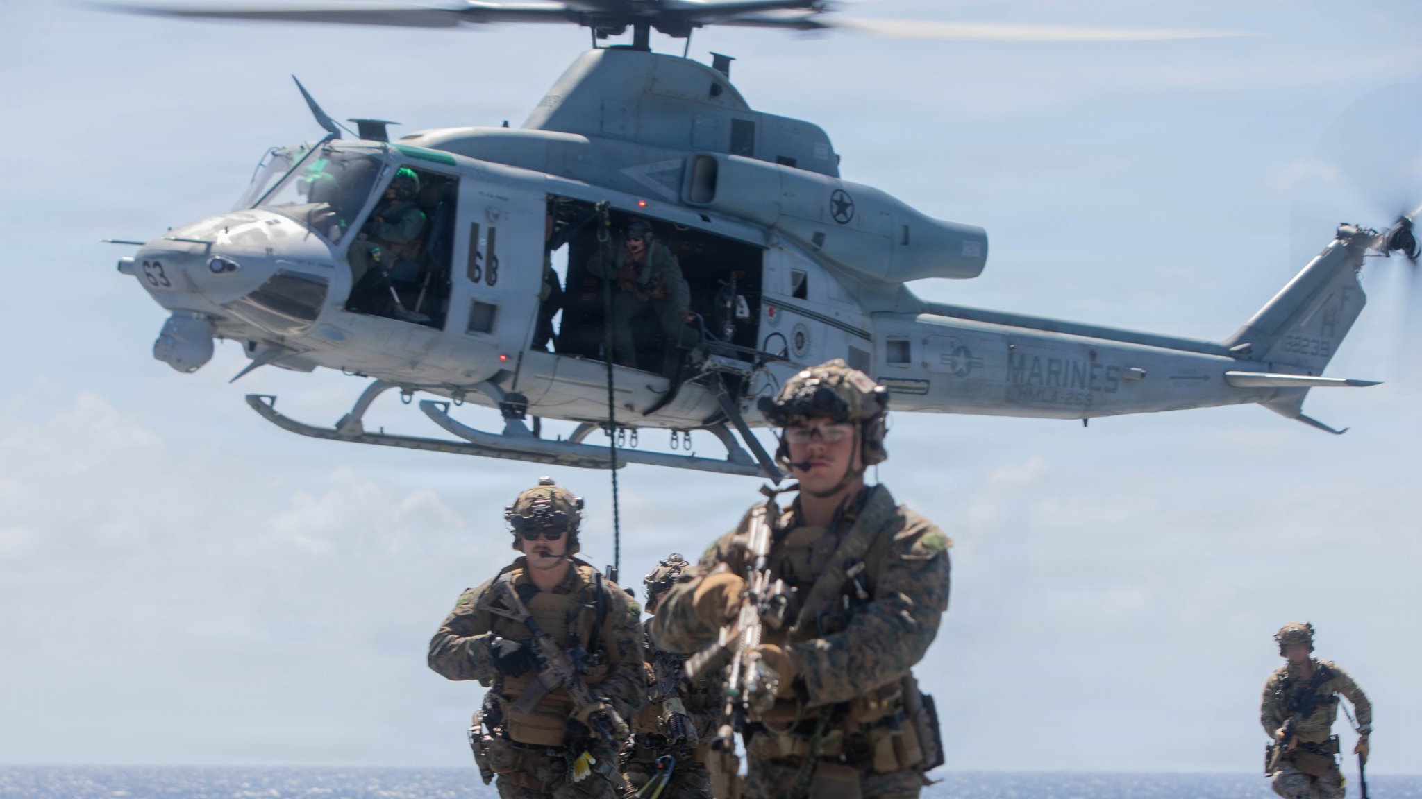 U.S. Marines with Maritime Raid Force, Littoral Combat Force-24, move to their objective after fast-roping off of a UH-1Y Venom assigned to Marine Medium Tiltrotor Squadron (VMM) 365 (Reinforced), LCF-24, during a Maritime Interdiction Operation Full Mission Profile rehearsal aboard San Antonio-class amphibious transport dock USS Fort Lauderdale (LPD 28) while underway in the Caribbean Sea, May 22, 2026. U.S. military forces are deployed to the U.S. Southern Command area of responsibility in support of Operation SOUTHERN SPEAR, Department of War-directed operations, and the president’s priorities to disrupt illicit drug trafficking, deter malign actors and protect the homeland through continuous presence. (U.S. Marine Corps photo) 