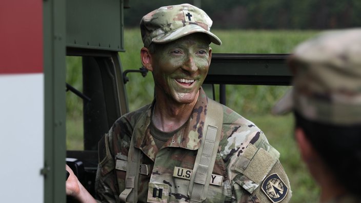 Captain John Miller, 716th Military Police Battalion Chaplain, calls a 9-line medevac as part of the Best Unit Ministry Team Competition, July 27, 2022, on Fort Campbell, KY. The Best Unit Ministry Competition is a multi day challenge including an Army Combat Fitness Test, land navigation, 8-mile foot march, obstacle course, and tactical religious support knowledge board designed to test the mental and physical capabilities of chaplains and religious affairs specialists. (U.S. Army Photo by Pfc. Matthew Wantroba)