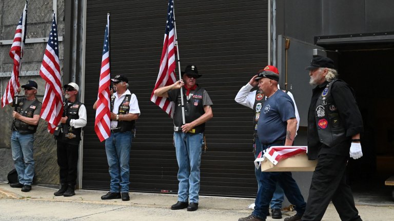 ALBANY, NY - MAY 20: The Grand Union flag covers a casket containing the remains of a Revolutionary War soldier during a dignified transfer from the State Museum to be taken by motorcade to Lake George Battlefield Park on Wednesday, May 20, 2026, in Albany, N.Y. Forty-four people believed to have been associated with the Continental Army were taken by motorcade to be buried at the Lake George Battlefield Park. (Will Waldron/Albany Times Union via Getty Images)