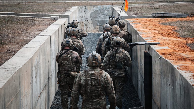 U.S. Army Green Berets assigned to 3rd Special Forces Group (Airborne) clear a trench during a live-fire exercise at the Joint Readiness Training Center (JRTC) on Fort Polk, Louisiana, March 23, 2026. The rotation validated the unit’s ability to conduct unconventional warfare in a simulated large-scale combat operations environment to meet the growing demands of an evolving security environment. (U.S. Army photo by Pfc. Edgar Martinez)