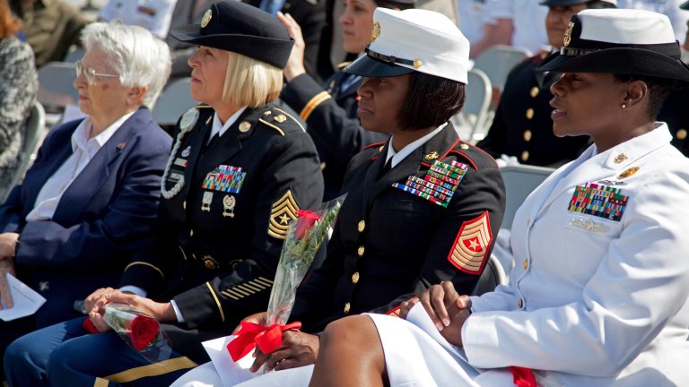 Sgt. Major Lanette Wright, sergeant major of the 24th Marine Expeditionary Unit, listens to a speech given by a congress woman during the Military Wreath Laying Ceremony at the Women in Military Service for America Memorial, Arlington, Virginia, May 20, 2014. The Congressional Caucus for Woman's Issues hosted the ceremony at the memorial. The caucus recognized Wright as an outstanding female Marine senior enlisted non-commissioned officer.