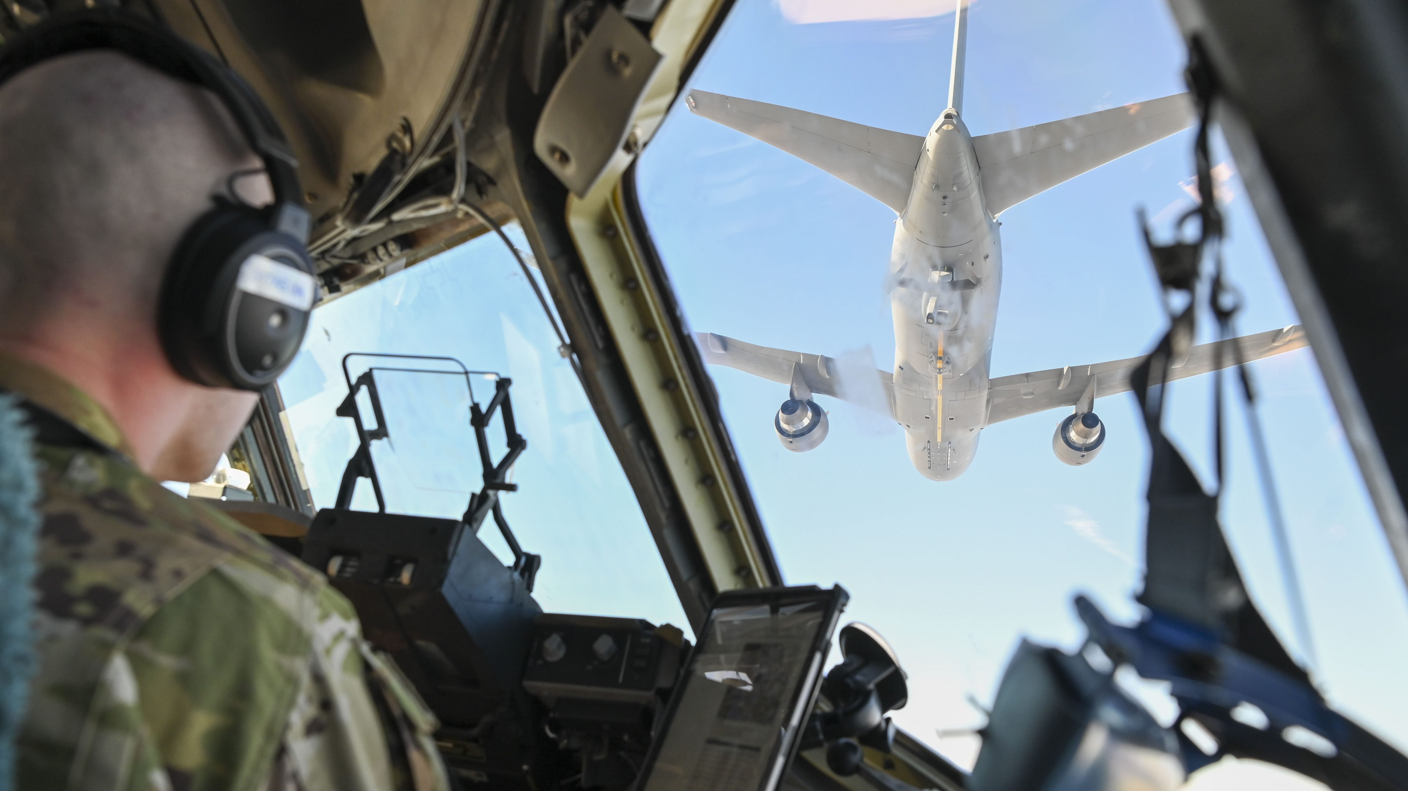 U.S. Air Force Maj. Jacob Pruitt, 7th Expeditionary Airlift Squadron pilot, conducts low-altitude aerial refueling training with a KC-46 Pegasus from 305th Air Mobility Wing from Joint Base McGuire-Dix-Lakehurst , while instructing pilots from the 517th Airlift Squadron from Joint Base Elmendorf in the Pacific region, Feb. 11, 2025. This training enhances operational readiness and refueling proficiency in contested environments. (U.S. Air Force photo by Senior Airman Elizabeth Nash)