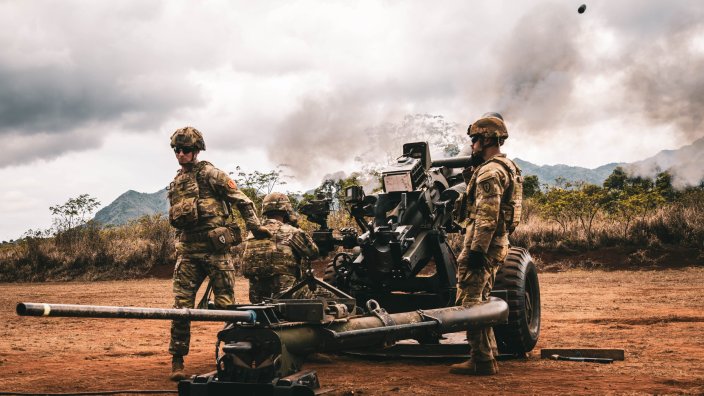 Soldiers of the 2nd Battalion, 11th Field Artillery Regiment, 25th Infantry Division, fire an M119 howitzer during the battalion’s cannon retirement ceremony on Sept. 25, 2025, at Schofield Barracks, Hawaii. The final firing honored over 100 years of history and achievements while marking the transition of the battalion’s cannons to the 3rd Battalion, 7th Field Artillery Regiment. (U.S. Army photo by Sgt. Taylor Gray)