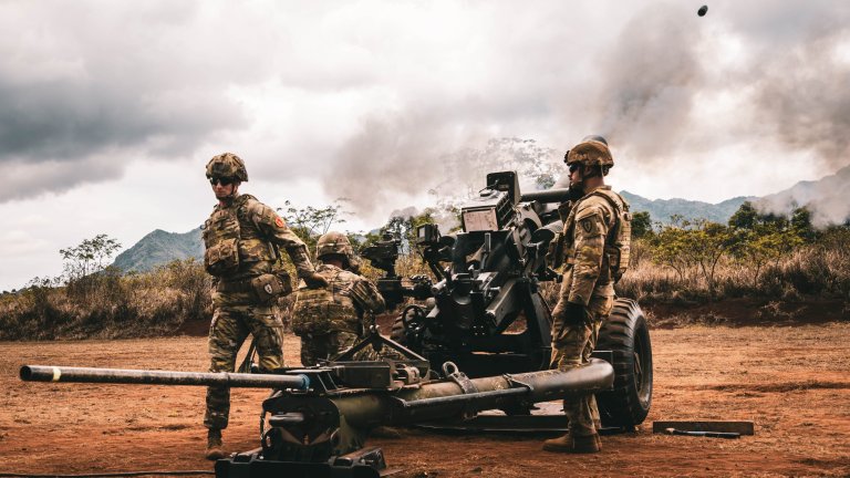 Soldiers of the 2nd Battalion, 11th Field Artillery Regiment, 25th Infantry Division, fire an M119 howitzer during the battalion’s cannon retirement ceremony on Sept. 25, 2025, at Schofield Barracks, Hawaii. The final firing honored over 100 years of history and achievements while marking the transition of the battalion’s cannons to the 3rd Battalion, 7th Field Artillery Regiment. (U.S. Army photo by Sgt. Taylor Gray)