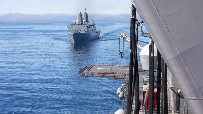 Image: The San Antonio-class amphibious transport dock USS Anchorage (LPD 23) approaches the Wasp-class amphibious assault ship USS Makin Island (LHD 8) during a fueling-at-sea evolution, Oct. 19, 2025. Makin Island is currently underway conducting routine operations in the U.S. 3rd Fleet. (U.S. Navy photo by Mass Communication Specialist Seaman Apprentice Kaitlyn Ratliff) 