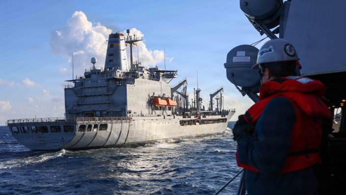 Arleigh Burke-class guided-missile destroyer, USS Thomas Hudner (DDG 116) steams alongside Henry J. Kaiser-class fleet replenishment oiler USNS Kanawha (T-AO 196) before a replenishment-at-sea while underway in the Caribbean Sea, Jan. 8, 2026. U.S. military forces are deployed to the Caribbean in support of the U.S. Southern Command mission, Department of War-directed operations, and the president’s priorities to disrupt illicit drug trafficking and protect the homeland. (U.S. Navy photo) 