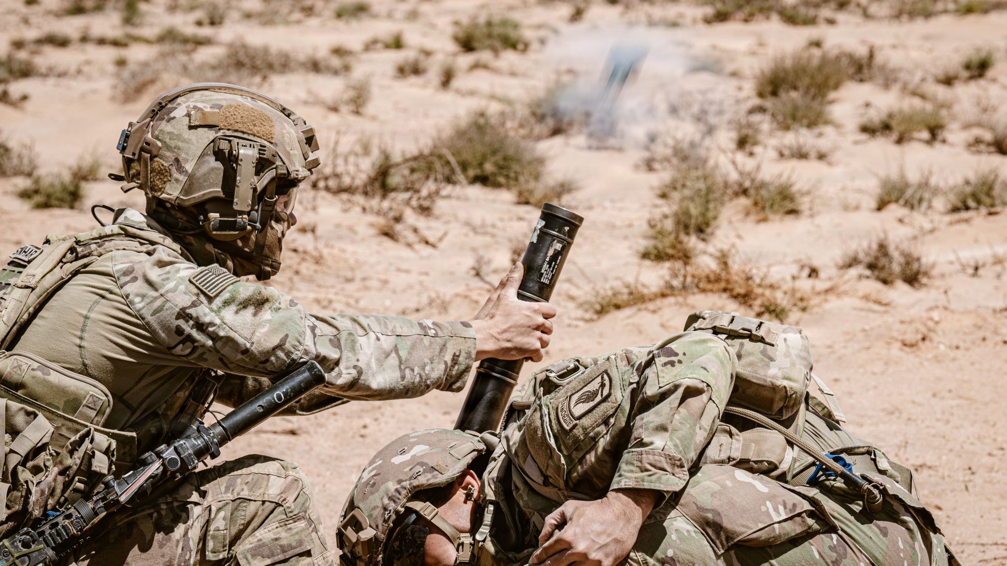 Image:  U.S. Soldiers assigned to MoD Company, 1st Battalion, 503rd Infantry Regiment, 173rd Mobile Brigade Combat Team (Airborne), fire mortars down range during an African Lion 26 counterattack exercise at Cap Draa, Tan-Tan, Morocco, May 4, 2026. The command field exercise counterattack lane tested new combined arms breach tactics by synchronizing unmanned ground vehicles, remote systems and maneuver elements, demonstrating the integration of autonomous and conventional forces to create standoff, reduce risk and generate new tactical possibilities on the modern battlefield. Army photo by Sgt. Christopher Sanchez 