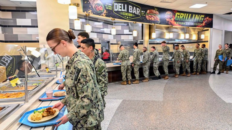 260529-N-YM856-1452 GULFPORT, MS (May 29, 2026) Sailors try new menu options during the reopening of Colmer Dining Facility following the facility’s food service transformation, May 29. The “campus style” dining pilot program is part of the Navy’s shore food service transformation initiative to provide an improved galley experience to support warfighter readiness, wellness, and performance through better nutrition. (U.S. Navy Photo by Mass Communication Specialist 1st Class Brittney Kinsey)