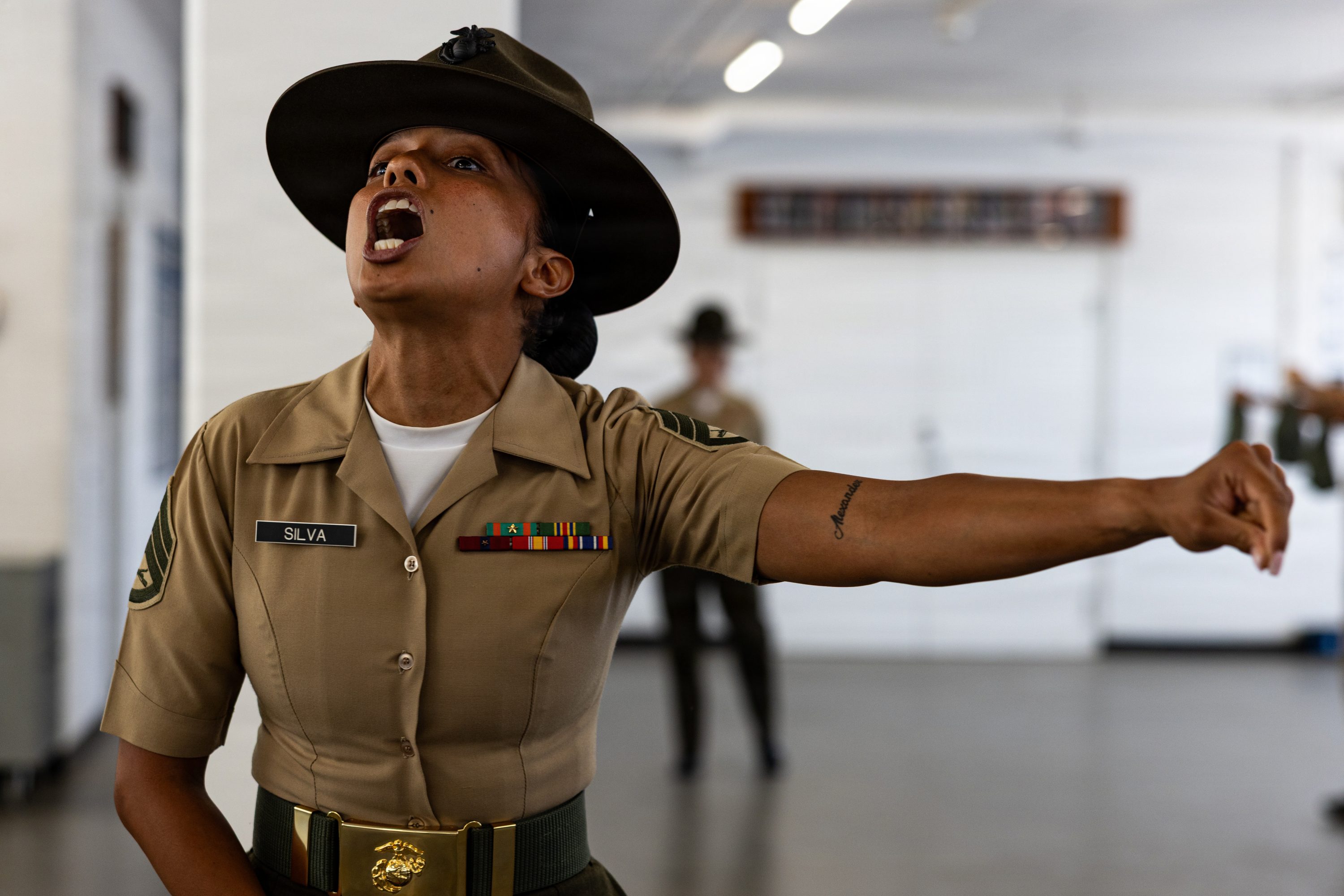 U.S. Marine Corps Staff Sgt. Esmeralda Silva, a drill instructor with Mike Company, 3rd Recruit Training Battalion, instructs her recruits during Pick-Up Day at Marine Corps Recruit Depot San Diego, California, May 30, 2026. Pick-Up Day signifies the first official day of training in which recruits will meet their drill instructor team for the first time, prepare their gear and squad bays, and expectations are set for the remainder of their time in recruit training. (U.S. Marine Corps photo by Cpl. Evelyn Doherty)