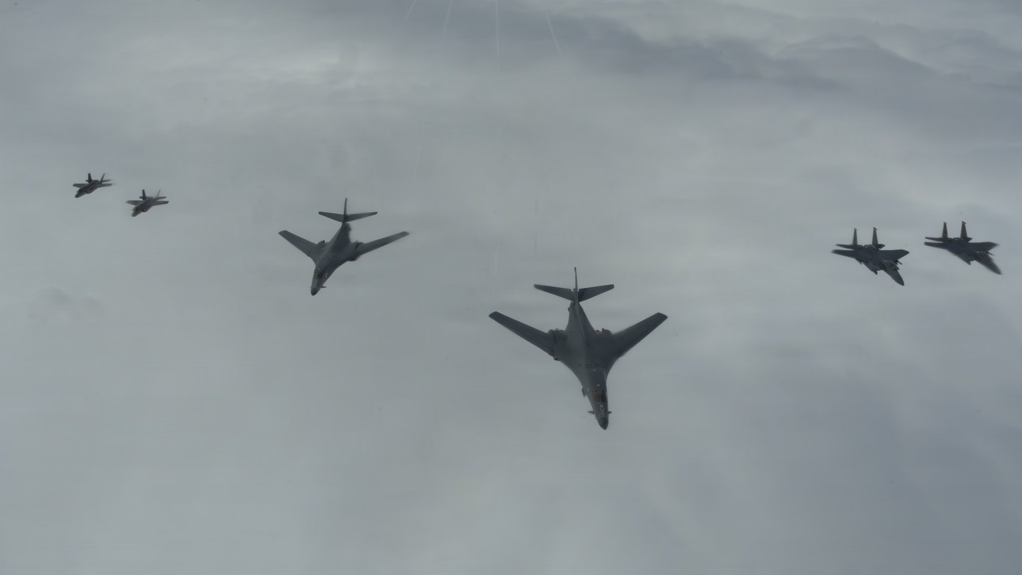 U.S. Air Force B-1B Lancers, F-15E Strike Eagles, and F-35A Lightning IIs fly in a formation during Astral Knight 26 over the North Sea, June 8, 2026. Aerial refueling operations increase the range and endurance of combat aircraft, supporting tactical integrated air and missile defense and tactical command and control during AK26. (U.S. Air Force photo by Staff Sgt. Nash Truitt)  Caption: Air Force B-1B bombers, F-15E Strike Eagles and F-35A Lightning IIs fly over the North Sea on June 8, 2026 as part of the Astral Knight 26 exercise. U.S. Air Force photo by Staff Sgt. Nash Truitt
