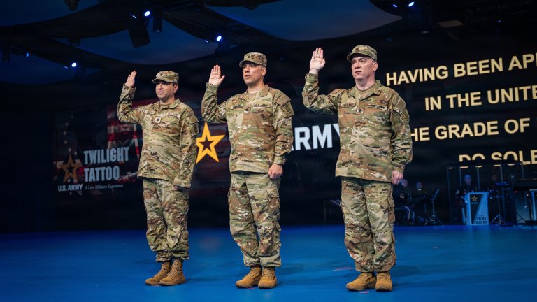 U.S. Army Lt. Col. Dane Knecht, left, Lt. Col. Serkan Piantino, center, and Lt. Col. Sam Pullara raise their right hands as U.S. Army Sec. Daniel P. Driscoll administers the oath of office during the commissioning of members of Detachment 201, also known as the Executive Innovation Corps, at Twilight Tattoo on Joint Base Myer-Henderson Hall, Virginia, June 10, 2026. Detachment 201 is an Army initiative that integrates civilian technical expertise to support innovation and modernization efforts across the force. The commissioning ceremony was conducted as part of the Army's 251st Birthday celebration. (U.S. Army photo by Sgt. Christopher Smith)