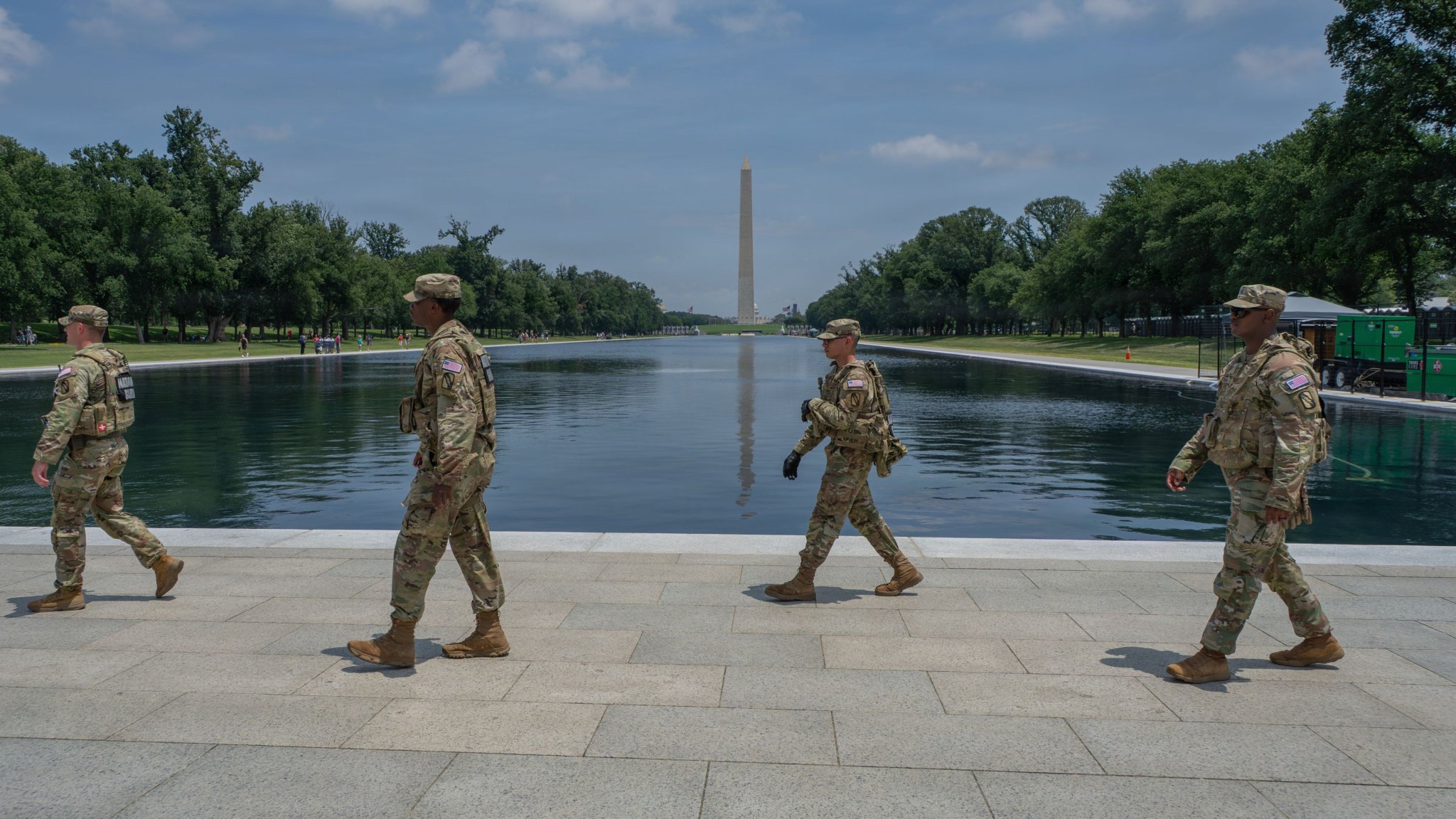 From left, U.S. Army Sgt. Andrew Guthrie, Spc. Terrance Echols, Spc. Charles Wheaton, and Pfc. Labrannon Hughes, all assigned to 890th Engineer Battalion, Mississippi National Guard, Joint Task Force Magnolia, patrol in front of the Lincoln Memorial Reflecting pool in Washington, D.C., June 10, 2026. Approximately 3,000 National Guard members support the DC Safe and Beautiful mission, providing critical assistance to the Metropolitan Police Department and community partners to enhance safety and quality of life throughout the District. (U.S. Army National Guard photo by Sgt. Christian Brown) 