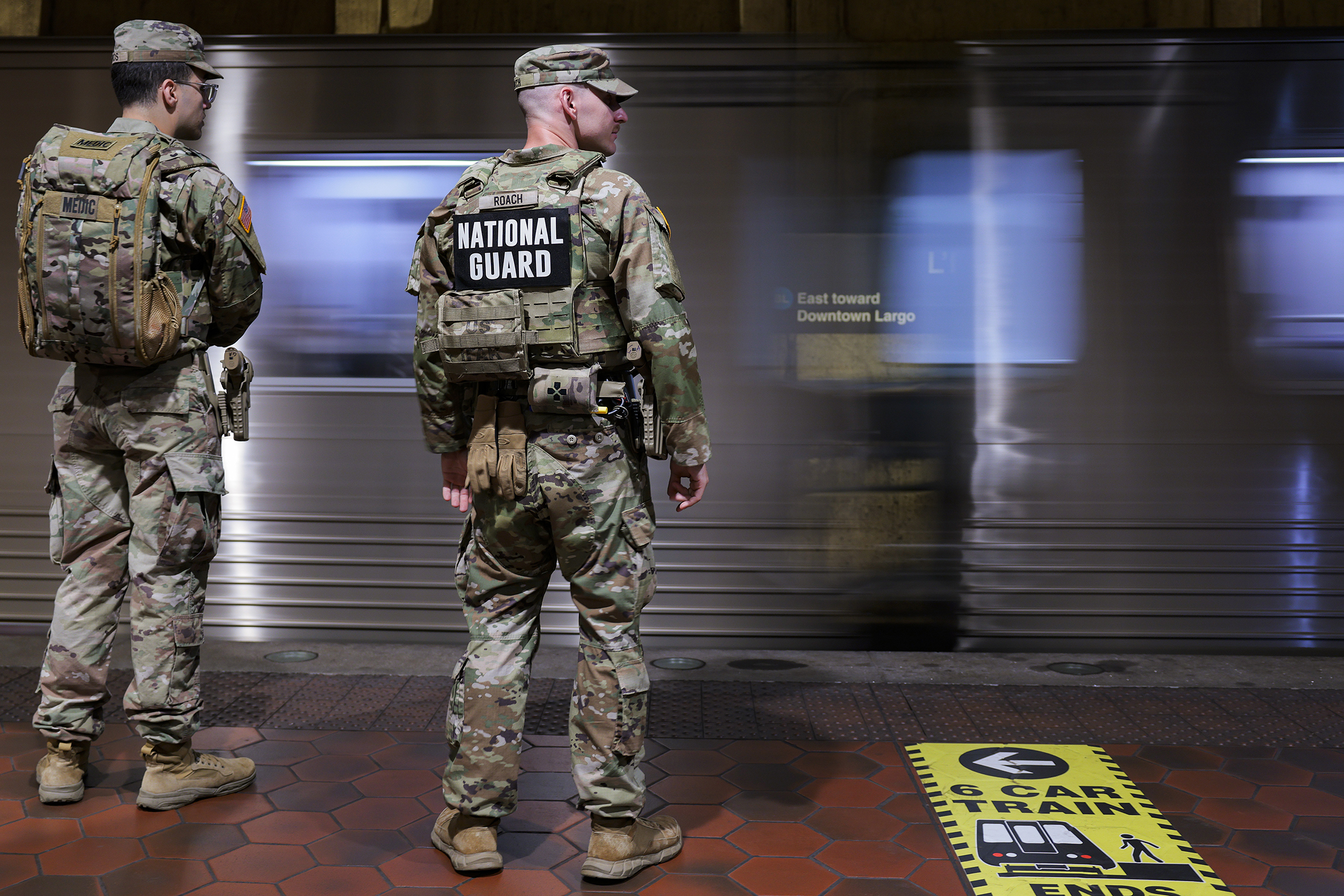 WASHINGTON, DC - APRIL 15: Members of the National Guard wait to board the WMATA Metro on April 15, 2026 in Washington, DC. President Donald Trump deployed members of the National Guard in August 2025 and he says he wants them to remain in the city. (Photo by Heather Diehl/Getty Images)