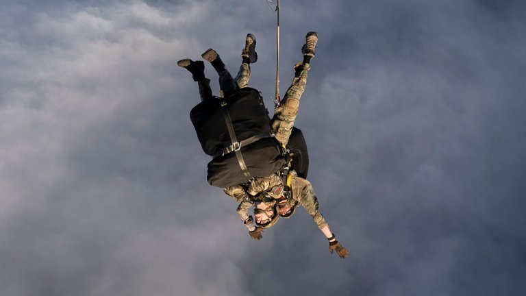 TRISTAN DA CUNDHA, BRITISH OVERSEAS TERRITORY - MAY 9: (EDITOR'S NOTE: This Handout image was provided by a third-party organization and may not adhere to Getty Images' editorial policy.) In this handout image provided by the UK Ministry of Defence, a paratrooper from 16 Air Assault jumps in tandem with an ICU nurse from an RAF Atlas A400M, which took off from Ascension Island to drop medical support and supplies on the remote Atlantic island of Tristan da Cunha on May 9, 2026 in Tristan da Cunha, British Overseas Territory. A British national who lives on the island reported symptoms of Hantavirus following his disembarkation from the MV Hondius cruise ship in mid-April. Three passengers who were aboard the Hondius have died from Hantavirus, with several more cases confirmed. (Handout photo by AS1 Georgia Callaway/MoD Crown Copyright via Getty Images)