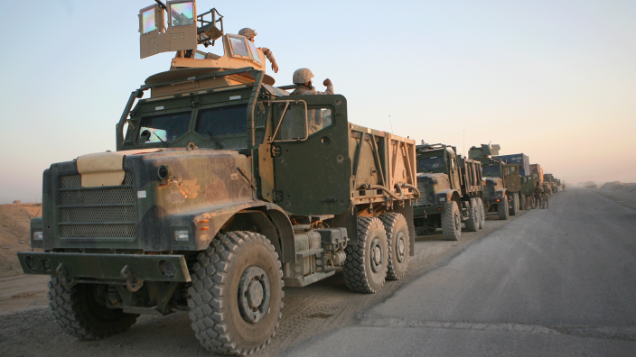 Marines of 1st Platoon, Combat Logistics Company 115 return to the safety of Camp Fallujah the morning of May 24, 2006.