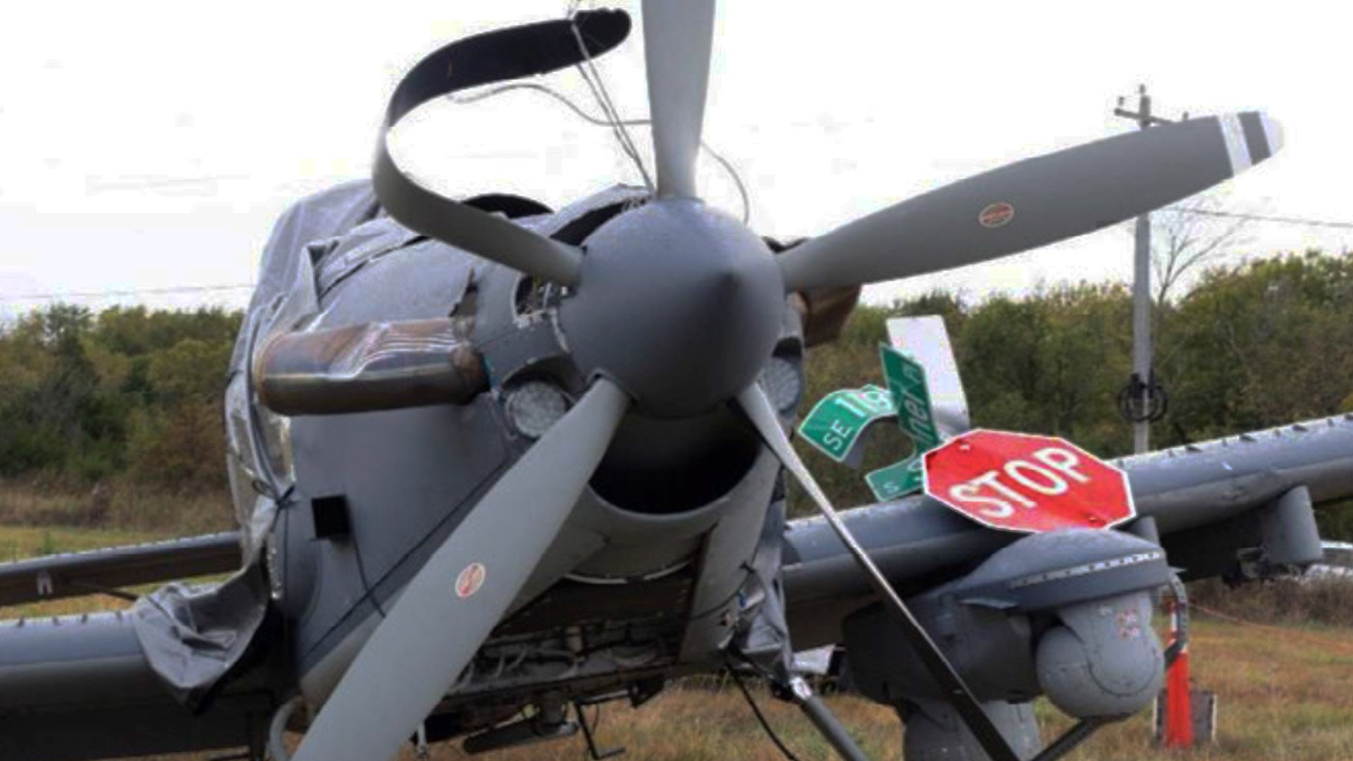 An Air Force OA-1K Skyraider II made an emergency landing in October 2025, skiding across an Oklahoma intersection, embedding a stop sign in the wing.