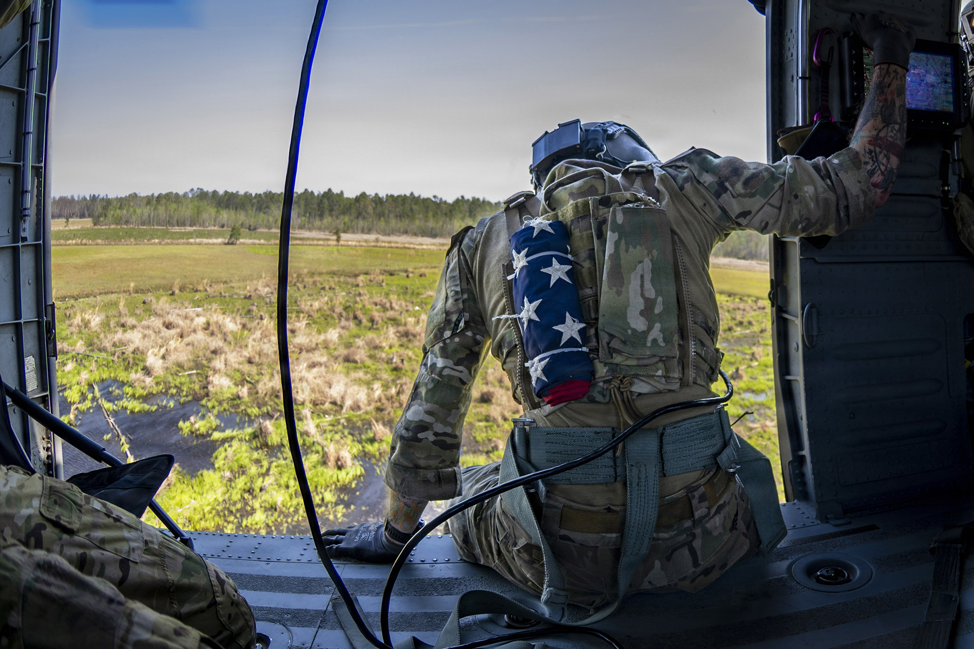 A U.S. Air Force Special Missions Aviator (SMA) assigned to the 41st Rescue Squadron prepares to land in an HH-60W Jolly Green II at Moody Air Force Base, Georgia, March 27, 2026. SMAs oversee mission systems and provide critical input to enhance crew coordination and operational effectiveness. (U.S. Air Force photo by Airman Bre Lewis)