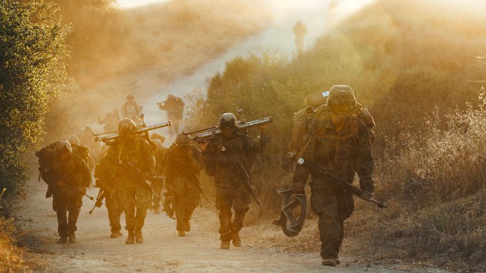 U.S. Marines with Alpha Company, Infantry Training Battalion, School of Infantry - West, conduct a hike during a Warfighting Field Exercise at Marine Corps Base Camp Pendleton, Calif., July 9, 2026. The WARFEX serves as the culminating event at ITB, evaluating students’ proficiency in decision-making and physical capabilities that will familiarize them with the skills of a Marine Corps Basic Infantryman. (U.S. Marine Corps photo by Sgt. Haley Fourmet Gustavsen)