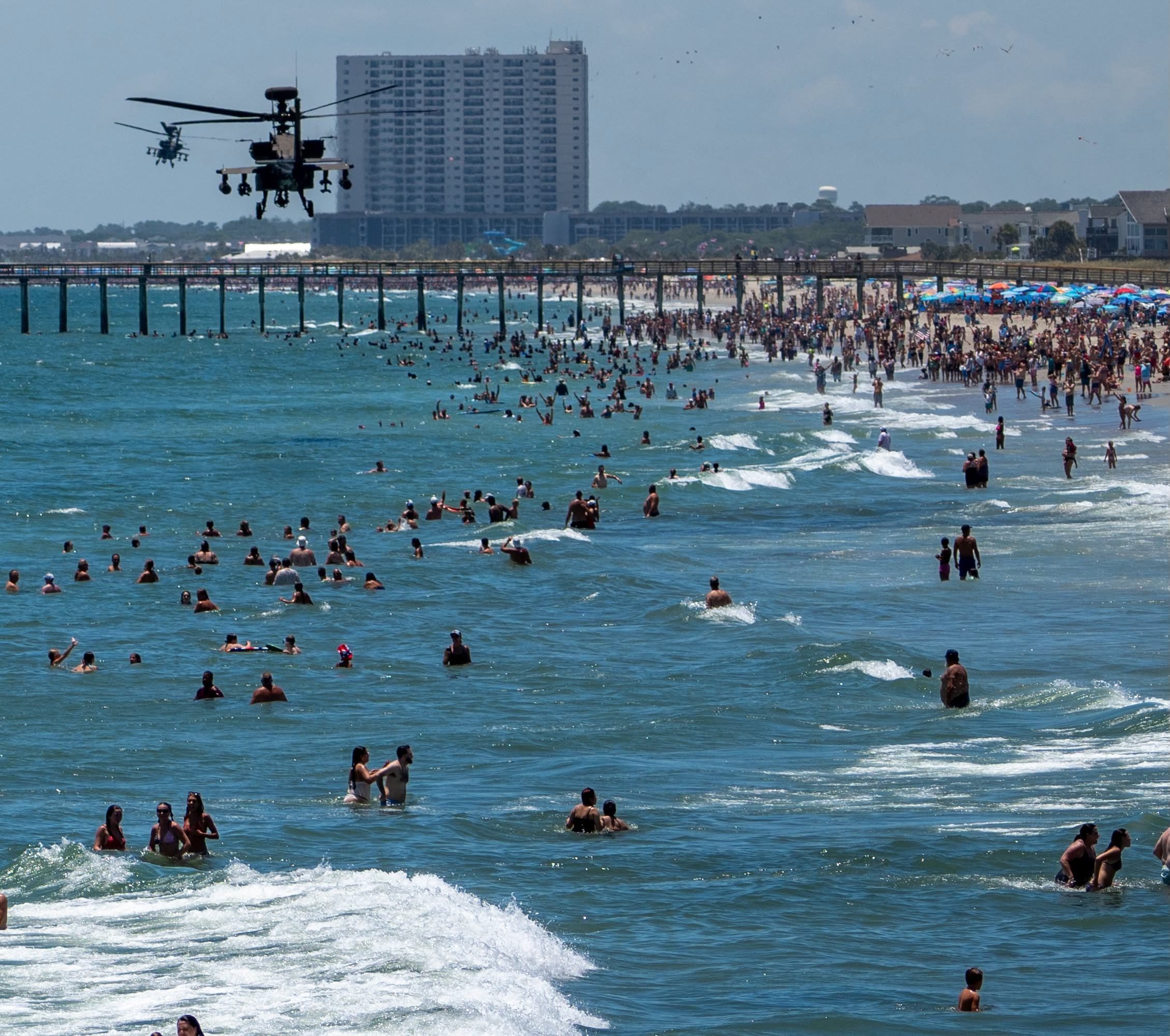 Two AH-64E Apache helicopters fly plast Myrtle Beach, South Carolina on July 4, 2026.