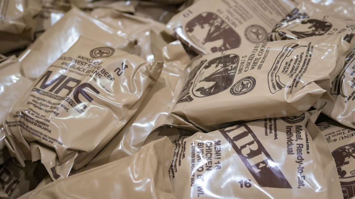 A supply of Meals Ready-to-Eat (MREs) is prepared for distribution to 944th Fighter Wing Reserve Citizen Airmen during Exercise Desert Hammer 25-1 at Luke Air Force Base, Ariz., Nov. 13, 2024. Set against the unmatched backdrop of the Barry M. Goldwater Range, Desert Hammer leverages Arizona’s strategic geography to provide realistic combat training for U.S. and allied forces. (U.S. Air Force photo by Tech. Sgt. Tyler J. Bolken)