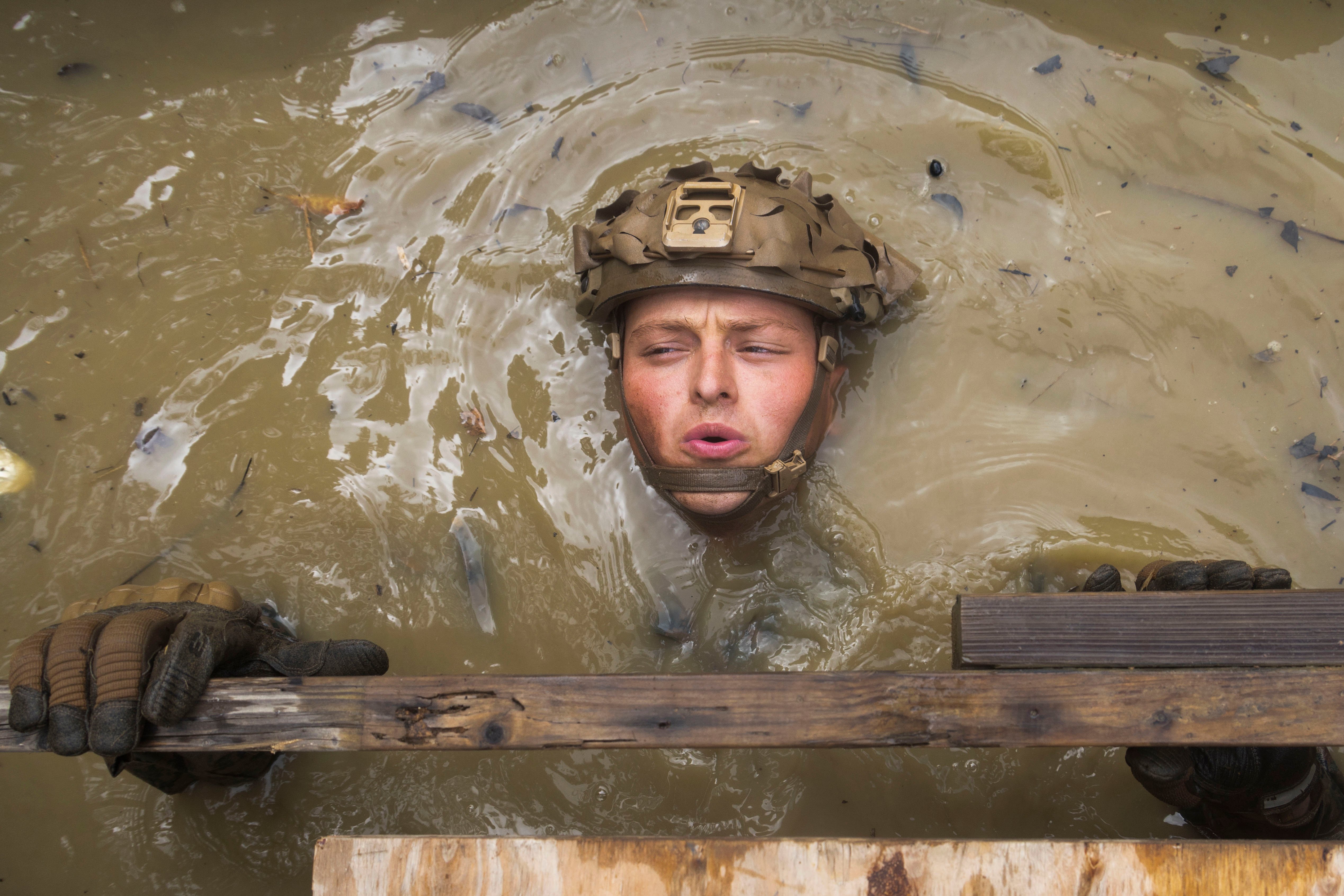 U.S. Marine Corps Sgt. Gavin Bart, a rifleman with Charlie Company, Battalion Landing Team 1st Battalion, 7th Marine Regiment, 31st Marine Expeditionary Unit, completes an obstacle the Basic Jungle Skills Course at the Jungle Warfare Training Center, Okinawa, Japan, September 24, 2025. The week-long course instructed the Marines on basic jungle survival skills, tactical rope suspension techniques, and jungle warfare tactics to enhance lethality in harsh jungle environments. Marines used ropes to enhance mobility within jungle terrains and instill confidence. The 31st MEU, the Marine Corps’ only continuously forward deployed MEU, provides a flexible and lethal force, ready to perform a wide range of military operations as the premiere crisis response force in the Indo-Pacific region. (U.S. Marine Corps photo by Lance Cpl. Trevor BishopWilliams)