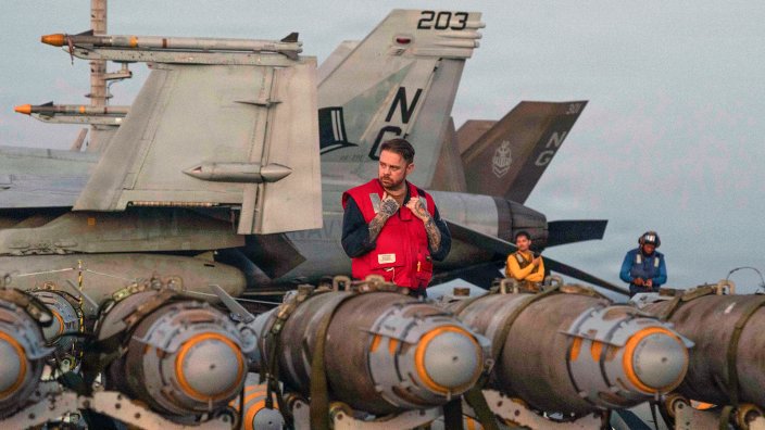 U.S. Sailors transfer ordnance on the flight deck of Nimitz-class aircraft carrier USS Abraham Lincoln (CVN 72), in the Arabian Sea, Feb. 27, 2026.