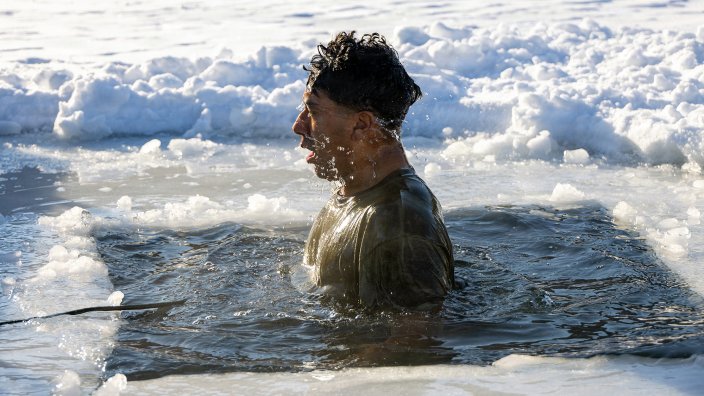 U.S. Marine Corps Lance Cpl. Andy Ngo, an Arkansas native and chemical, biological, radiological and nuclear defense specialist assigned to the Chemical Biological Incident Response Force, participates in a polar plunge during cold weather training at Camp Dawson, Feb. 10, 2026. The training equipped Marines and Sailors with the knowledge and skills to manage the effects of cold-water submersion and execute active rewarming procedures in preparation for Arctic Edge 26. (U.S. Marine Corps photo by Lance Cpl. Amy Espinoza)