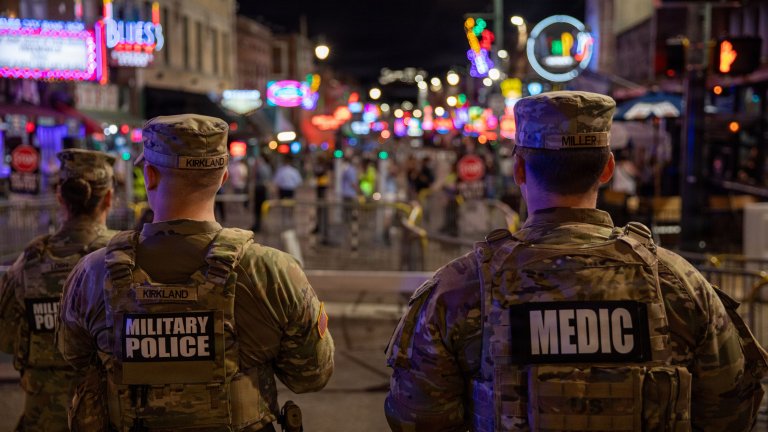 U.S. Army National Guard Military Police, assigned to the Memphis Safe Task Force, survey their surroundings as they conduct a safety patrol of Beale Street in Memphis, Tn., May. 24, 2026. Tennessee National Guardsmen are currently assisting the Memphis Safe Task Force with tasks such as community safety patrols, site security, and traffic control in support of ongoing efforts to reduce crime and promote public safety in Memphis. (U.S. Army National Guard photo by Sgt. Landon Evans)