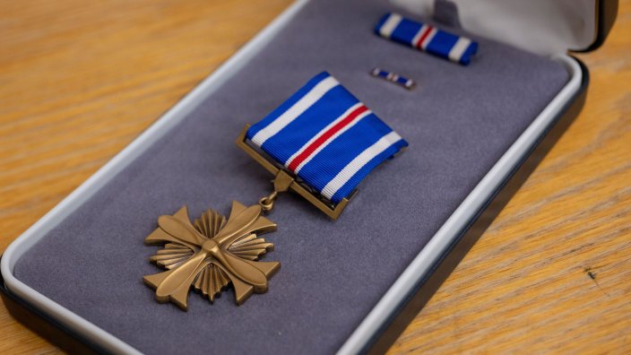 A Distinguished Flying Cross medal is displayed for presentation during a ceremony at Eielson Air Force Base, Alaska, July 1, 2026. The Distinguished Flying Cross recognizes heroism or extraordinary achievement while participating in an aerial flight and honors those whose actions go beyond the demands of duty during combat or active operations against an armed adversary. (U.S. Air Force Photo by Airman 1st Class Mary Murray)