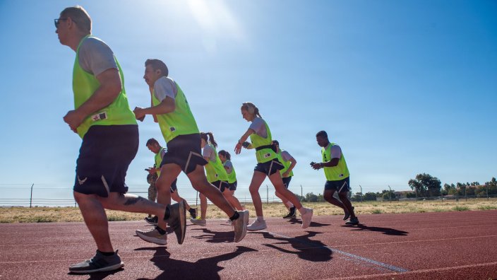 U.S. Airmen participate in a 2-mile run during a physical fitness assessment at Travis Air Force Base, California, July 15, 2026. Aerobic fitness assessments measure cardiovascular endurance and overall physical readiness. (U.S. Air Force photo by Kenneth Abbate) 