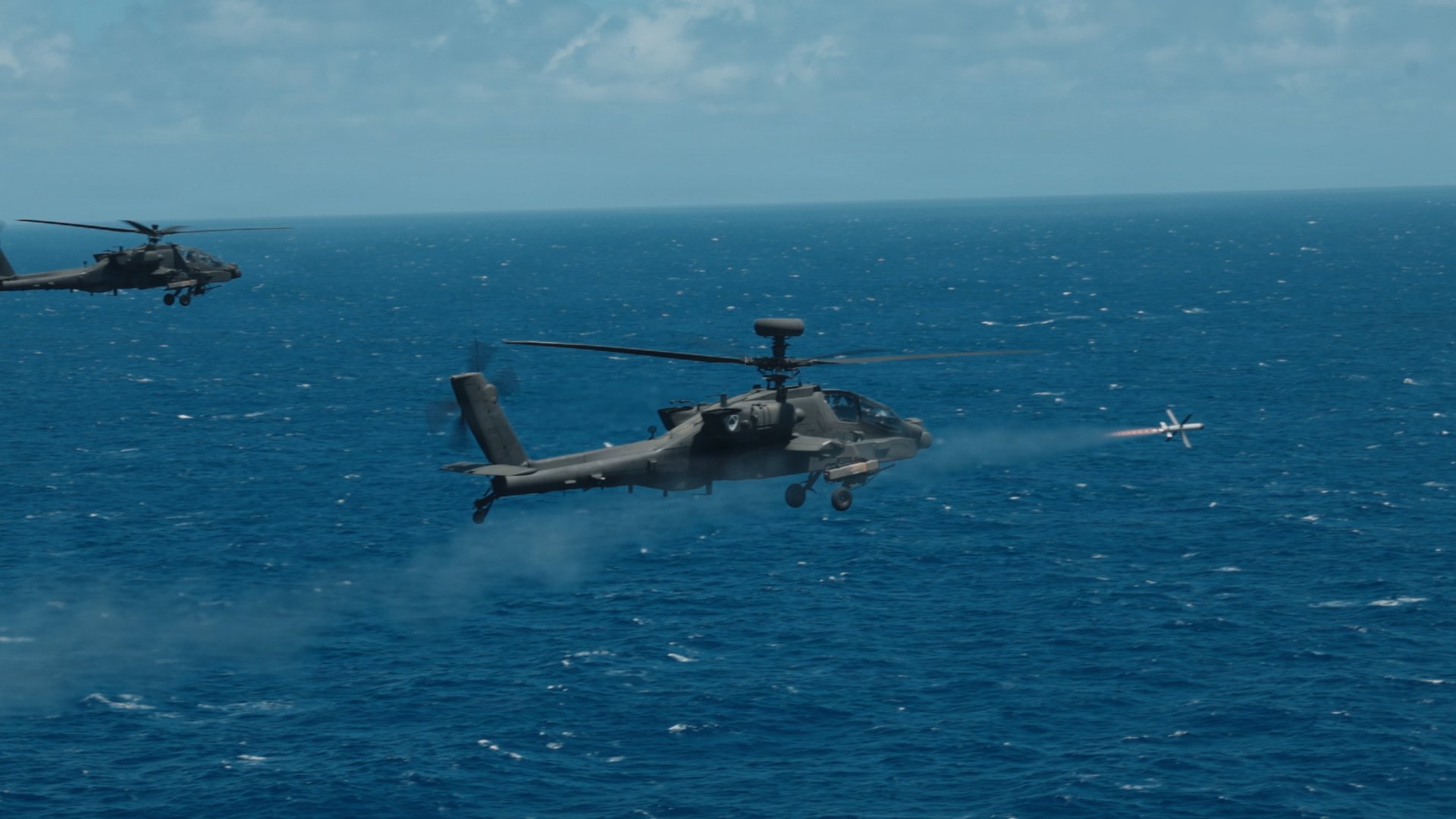 A U.S. Army AH-64 Apache from the 16th Combat Aviation Brigade, 7th Infantry Division, Multi-Domain Command - Pacific, fires a Spike Non-Line of Sight missile at the USS Mobile Bay for a Sink Exercise during Rim of the Pacific in Hawaii, July 11, 2026. Thirty nations, over 30 surface ships, five submarines, 15 national land forces, more than 206 aircraft and 30,000 personnel are participating in RIMPAC in and around the Hawaiian Islands, June 24 to July 31. The world's largest international maritime exercise, RIMPAC provides a unique training opportunity while fostering and sustaining cooperative relationships among participants critical to ensuring the safety of sea lanes and security on the world's oceans. RIMPAC 2026 is the 30th exercise in the series that began in 1971. (U.S. Army photo by Staff Sgt. Christian Morton)
