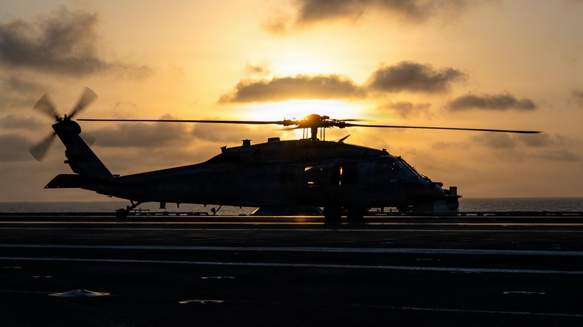 An MH-60S Sea Hawk attached to Helicopter Sea Combat squadron (HSC) 12 lands on the flight deck aboard Nimitz-class aircraft carrier USS George Washington (CVN 73), Sept. 26, 2026. George Washington is deployed to the U.S. 5th Fleet area of operations to support maritime security and stability in the Middle East. (U.S. Navy photo)