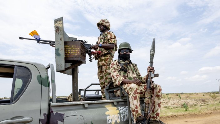 Nigerian soldiers from the Multinational Joint Task Force (MNJTF) stand guard in Monguno, Borno state, Nigeria, on July 5, 2025. Twelve checkpoints manned by the Nigerian army control the various entrances to Monguno. Monguno's huge fortifications have kept the garrison town mostly secure even as northeastern Nigeria has seen a recent surge in attacks on military bases by jihadists fighting a grinding 16 year war. Fighting in Borno may have eased since the conflict's highpoint in 2015 as jihadists have been forced back. But militants from Islamic State West Africa Province or rival Boko Haram have attacked or temporarily overrun a dozen military bases since the start of the year. (Photo by Joris Bolomey / AFP) (Photo by JORIS BOLOMEY/AFP via Getty Images)