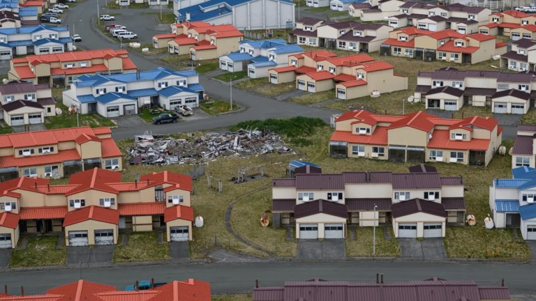 Many homes on the former Navy base in Adak, Alaska are uninhabitable after decades in the harsh climate, but many are counted in a tax-payer-funded program as having broadband internet access.