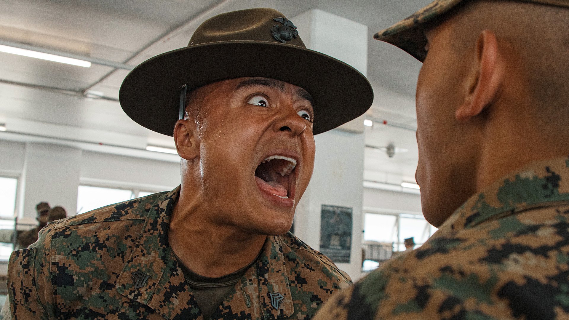 U.S. Marine Corps Sgt. Michael Lorenz, left, a drill instructor with India Company, 3rd Recruit Training Battalion, inspects a recruit during a senior drill instructor inspection at Marine Corps Recruit Depot San Diego, California, May 22, 2025. The SDI inspection is the first several inspections recruits will undergo throughout the duration of their training at MCRD San Diego and aims to ensure the recruits are upholding the orders given to them. (U.S. Marine Corps photo by Cpl. Sarah M. Grawcock)