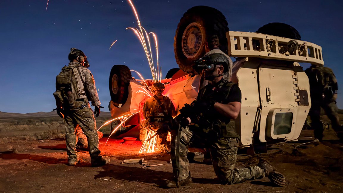 U.S. Air Force pararescuemen assigned to the 57th Rescue Squadron based out of Aviano Air Base, Italy, conduct a vehicle extraction of an isolated person during Exercise Savage Jackal at Playas, New Mexico, July 26, 2026. Vehicle extraction training enhanced the squadron's capability to recover isolated personnel from damaged vehicles while preparing rescue forces to respond to complex, real-world contingencies. (U.S. Air Force photo by Staff Sgt. Jenna A. Bond)