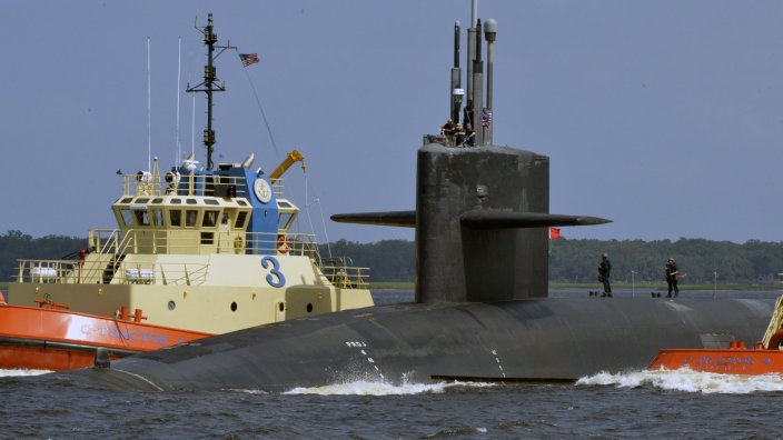 Image: The Ohio-class ballistic-missile submarine USS West Virginia (SSBN 736) returns to its homeport at Naval Submarine Base Kings Bay, Ga., following a strategic deterrent patrol. The boat is one of four ballistic-missile submarines stationed at the base and is capable of carrying up to 20 submarine-launched ballistic missiles with multiple warheads. (U.S. Navy photo by Lt. Katherine Diener)  The Ohio-class ballistic missile submarine USS West Virginia at port in 2018. Navy photo by Lt. Katherine Diener.