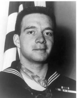 Navy Hospital Corpsman 3rd Class William Charette wears his Medal of Honor. Navy photo