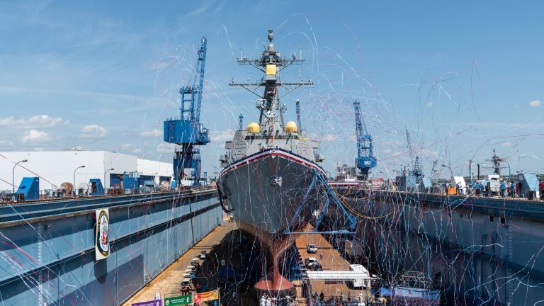 Ribbons stream around the dry dock at the christening of the USS William Charette.