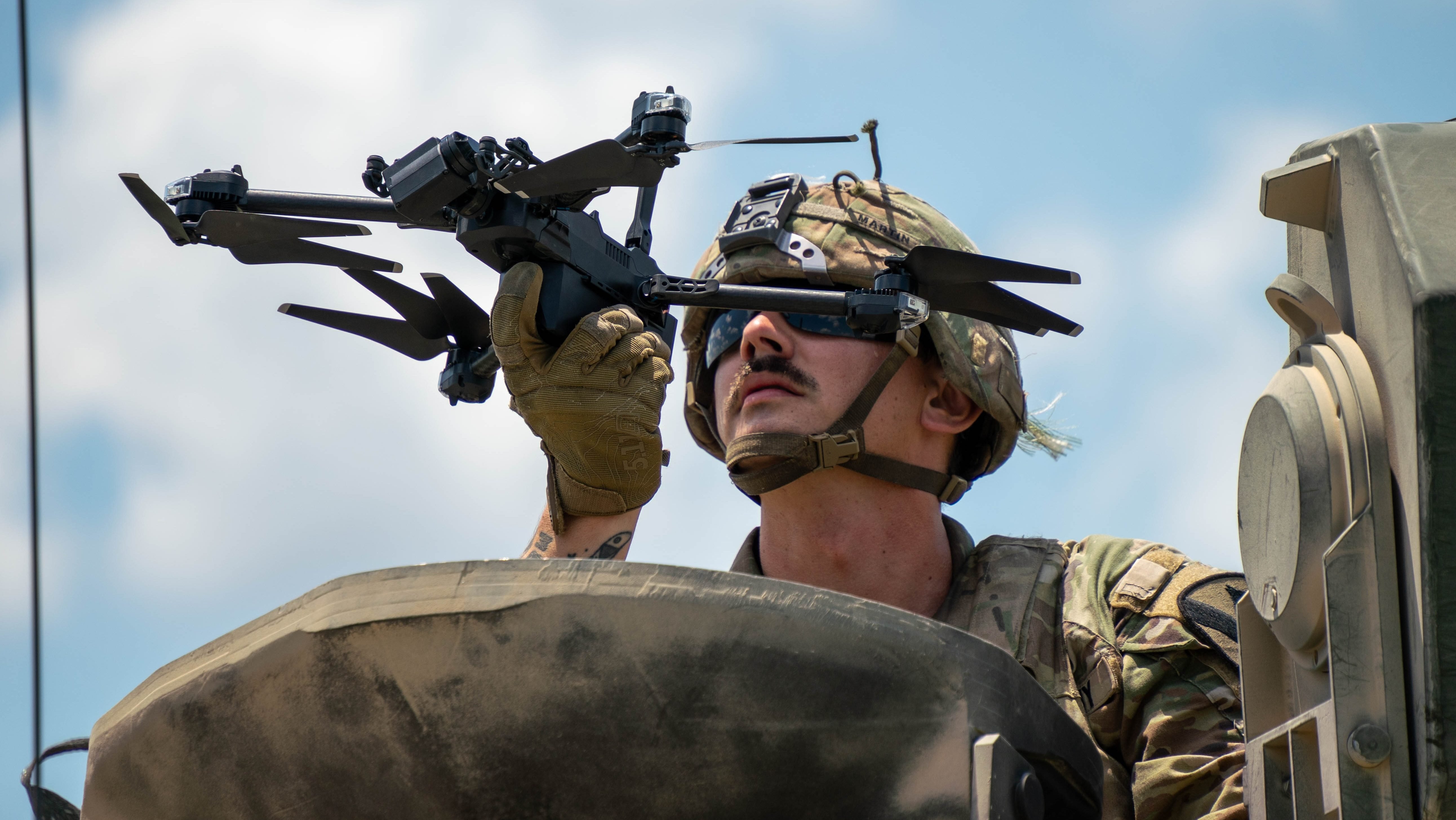 1st Cavalry Division Trooper, Sgt. Nathaniel Martin, an Unmanned Aircraft System Operator, assigned to 8th Brigade Engineer Battalion, 2nd Armored Brigade Combat Team, launches a drone from his hand during Pegasus Forge, on Fort Hood, Texas, Aug. 6, 2025. Pegasus Forge allows the First Team to utilize new technology and gain experience in the field to support and progress in the Army's Transformation in Contact initiative. (U.S. Army Photo by Spc. David Dumas)