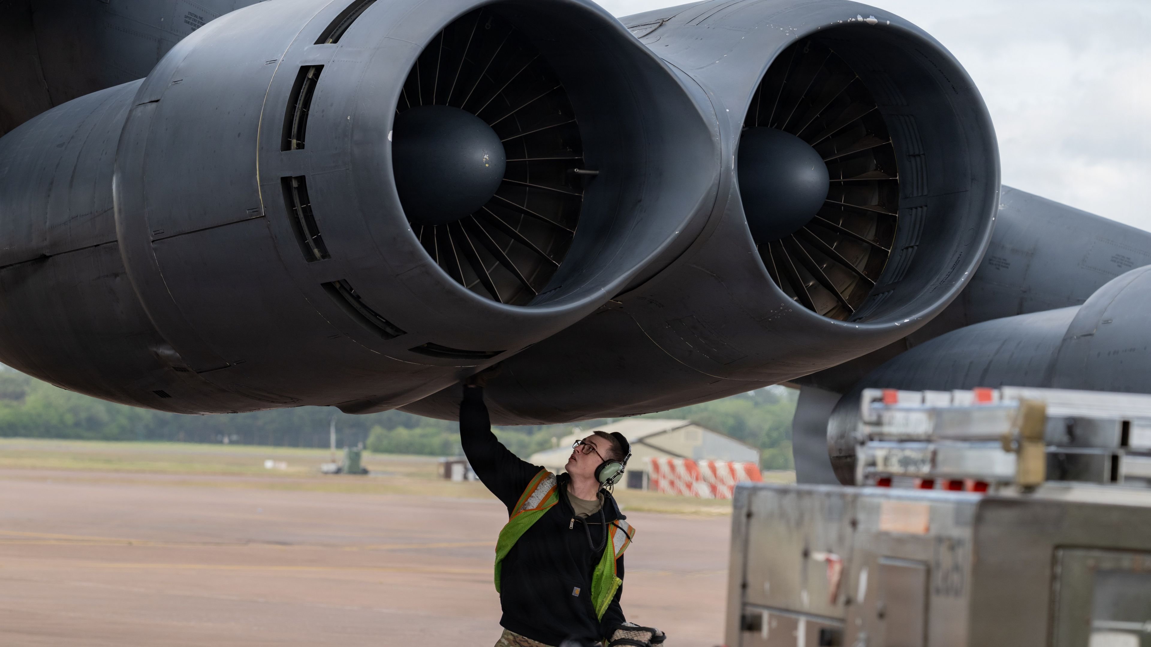 A U.S. Air Force Airman disconnects an auxiliary power unit from a U.S. Air Force B-52H Stratofortress aircraft at a base in the U.S. European Command area of responsibility in support of regional security in the U.S. Central Command AOR, May 20, 2026. (U.S. Air Force photo by Master Sgt. Eric Summers Jr.)