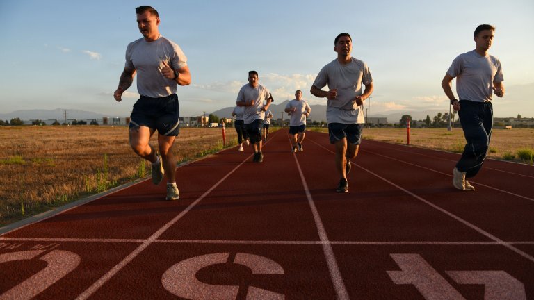 Airmen of the 163d Operations Support Squadron, California Air National Guard, run during group physical fitness training, March Air Reserve Base, Calif., June 24, 2026. The OSS has accelerated its fitness program over the last eight months, structured around the new Department of the Air Force’s Physical Fitness Assessment standards starting July 1, 2026. (U.S. Air National Guard Photograph by Senior Master Sgt. Julianne Sitterding)