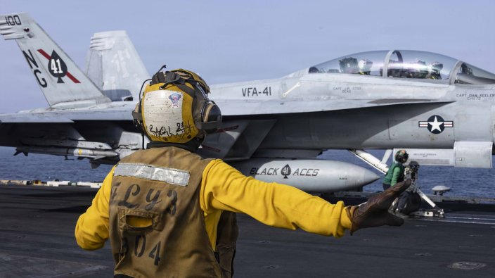 An F/A-18F Super Hornet, attached to Strike Fighter Squadron (VFA) 41, prepares to launch from the flight deck of Nimitz-class aircraft carrier USS Abraham Lincoln (CVN 72), June 25, 2026. Abraham Lincoln is deployed to the U.S. 5th Fleet area of operations to support maritime security and stability in the Middle East. (U.S. Navy photo)