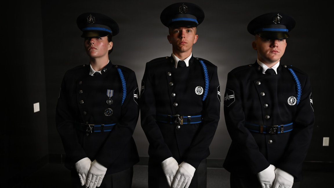 From left, U.S. Space Force Spc. 3 Amelia Olsen, Spc. 3 Dylan Lee, and Spc. 3 Logan Bergstrom, ceremonial guardsmen with the U. S. Space Force Honor Guard, model the new Honor Guard ceremonial uniforms at Joint Base Anacostia-Bolling, Washington, D.C., Aug. 21, 2026. The new uniform was designed to replace the modified U.S. Air Force service uniform Guardians wore when the branch was first established in 2019. (U.S. Air Force photo by Senior Airman Shanel Toussaint) 