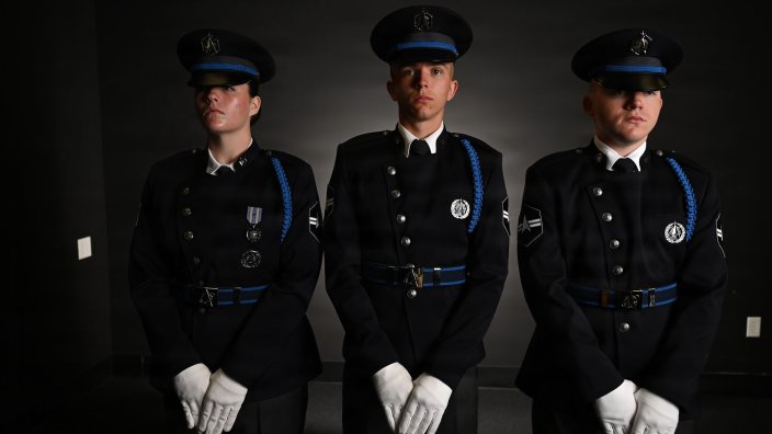 From left, U.S. Space Force Spc. 3 Amelia Olsen, Spc. 3 Dylan Lee, and Spc. 3 Logan Bergstrom, ceremonial guardsmen with the U. S. Space Force Honor Guard, model the new Honor Guard ceremonial uniforms at Joint Base Anacostia-Bolling, Washington, D.C., Aug. 21, 2026. The new uniform was designed to replace the modified U.S. Air Force service uniform Guardians wore when the branch was first established in 2019. (U.S. Air Force photo by Senior Airman Shanel Toussaint) 