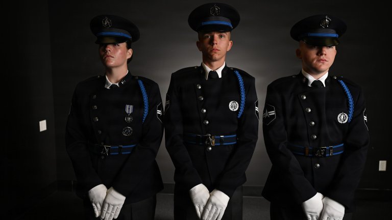 From left, U.S. Space Force Spc. 3 Amelia Olsen, Spc. 3 Dylan Lee, and Spc. 3 Logan Bergstrom, ceremonial guardsmen with the U. S. Space Force Honor Guard, model the new Honor Guard ceremonial uniforms at Joint Base Anacostia-Bolling, Washington, D.C., Aug. 21, 2026. The new uniform was designed to replace the modified U.S. Air Force service uniform Guardians wore when the branch was first established in 2019. (U.S. Air Force photo by Senior Airman Shanel Toussaint) 