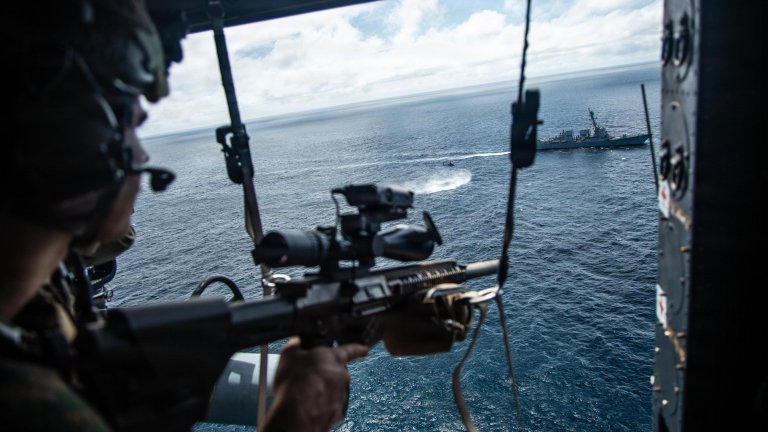 A U.S. Marine with Maritime Raid Force, Littoral Combat Force-24, provides aerial sniper support during a Maritime Interdiction Operation Full Mission Profile while underway in the Pacific Ocean, Aug. 21, 2026. U.S. military forces are deployed to the U.S. Southern Command area of responsibility in support of Joint Task Force Western Hemisphere, Department of War-directed operations, and the President's priorities to disrupt illicit drug trafficking, deter malign actors and protect the homeland through continuous presence. (U.S. Marine Corps photo) 