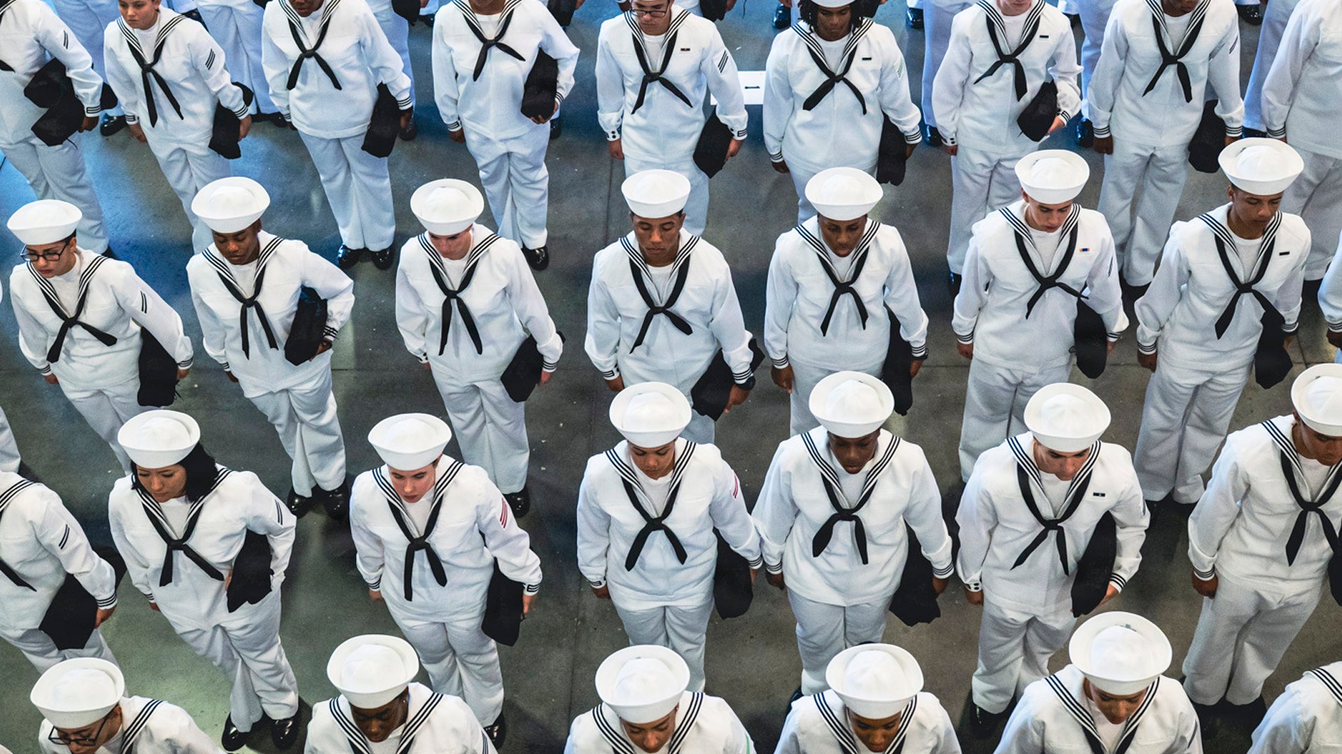 Sailors stand in formation during a pass-in-review ceremony at U.S. Navy Recruit Training Command in Great Lakes, Ill., Aug. 27, 2026.