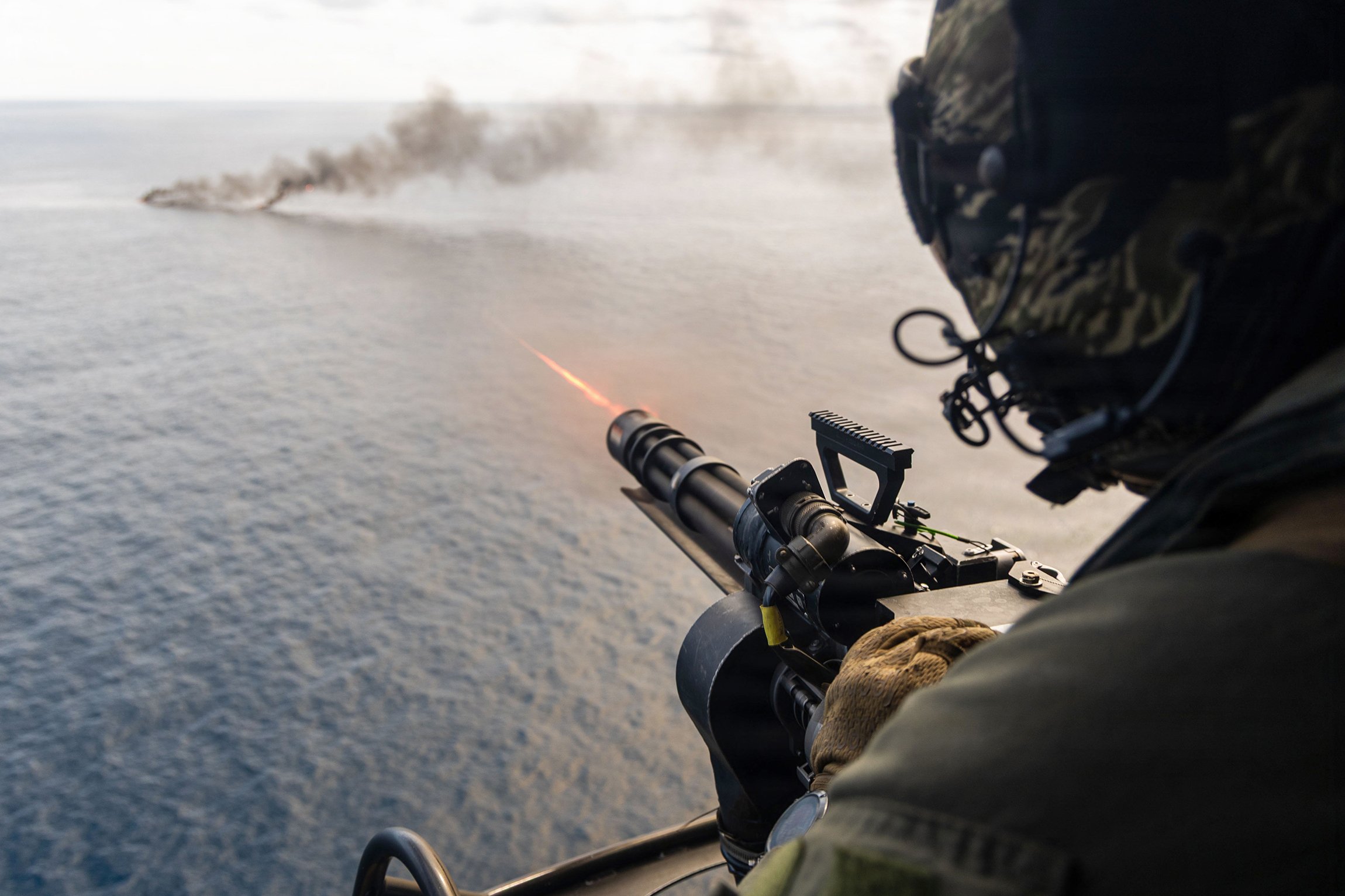 A Marine Corps UH-1Y Venom crew chief assigned to Littoral Combat Force-24 fires an M134 minigun during a maritime interdiction operation while underway in the Pacific Ocean, Sept. 2, 2026. The vessel of interest was boarded and cleared before being destroyed. U.S. military forces are deployed to the U.S. Southern Command area of responsibility supporting Joint Task Force Western Hemisphere, War Department-directed operations and the president's priorities to disrupt illicit drug trafficking, deter malign actors and protect the homeland through continuous presence.