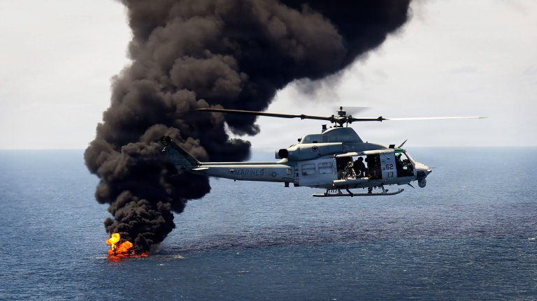 A U.S. Marine Corps UH-1Y Venom with Marine Medium Tiltrotor Squadron (VMM) 365 (Reinforced), Littoral Combat Force-24, flies over a vessel of interest being destroyed during a Maritime Interdiction Operation while in the Pacific Ocean, Sept. 05, 2026. The vessel of interest was boarded and cleared before being destroyed. U.S. military forces are deployed to the U.S. Southern Command area of responsibility in support of Joint Task Force Western Hemisphere, Department of War-directed operations, and the President's priorities to disrupt illicit drug trafficking, deter malign actors and protect the homeland through continuous presence. (U.S. Marine Corps photo)